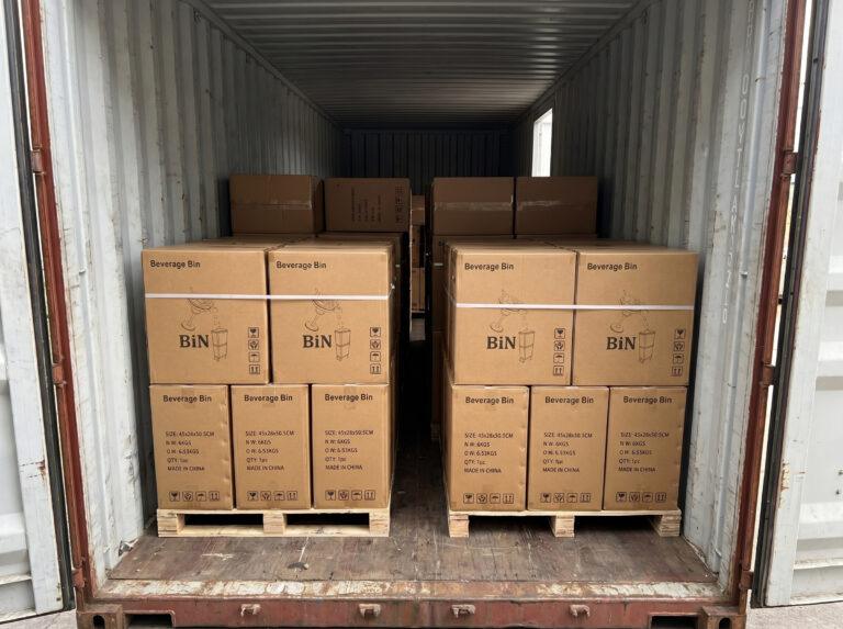 Shipping container loaded with pallets of Beverage Bin cartons
